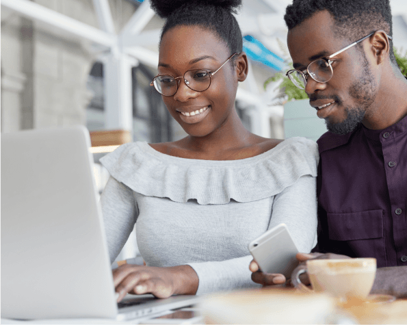 Man and woman in front of a laptop
